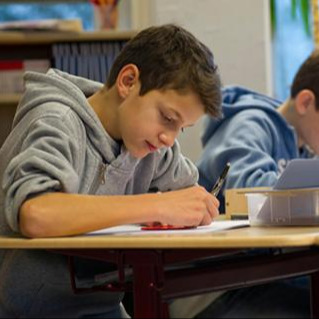 Student works with pen and ruler